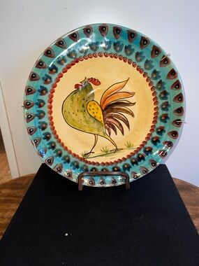 This hand-painted ceramic plate is a vintage piece from Horchow